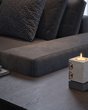 Geometric stone bookends holding books on a dark console table in a modern interior