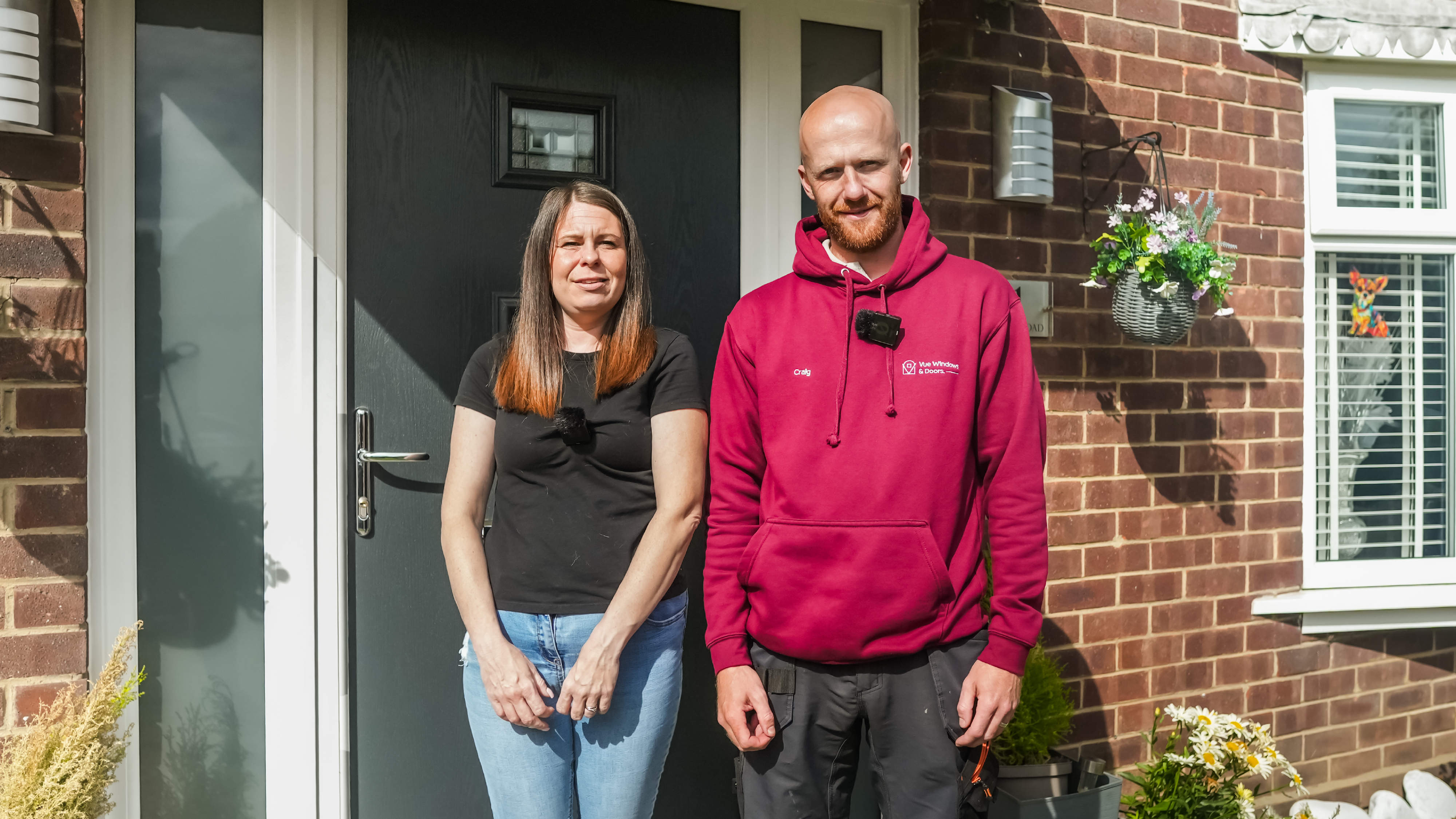 Happy customers with their new door