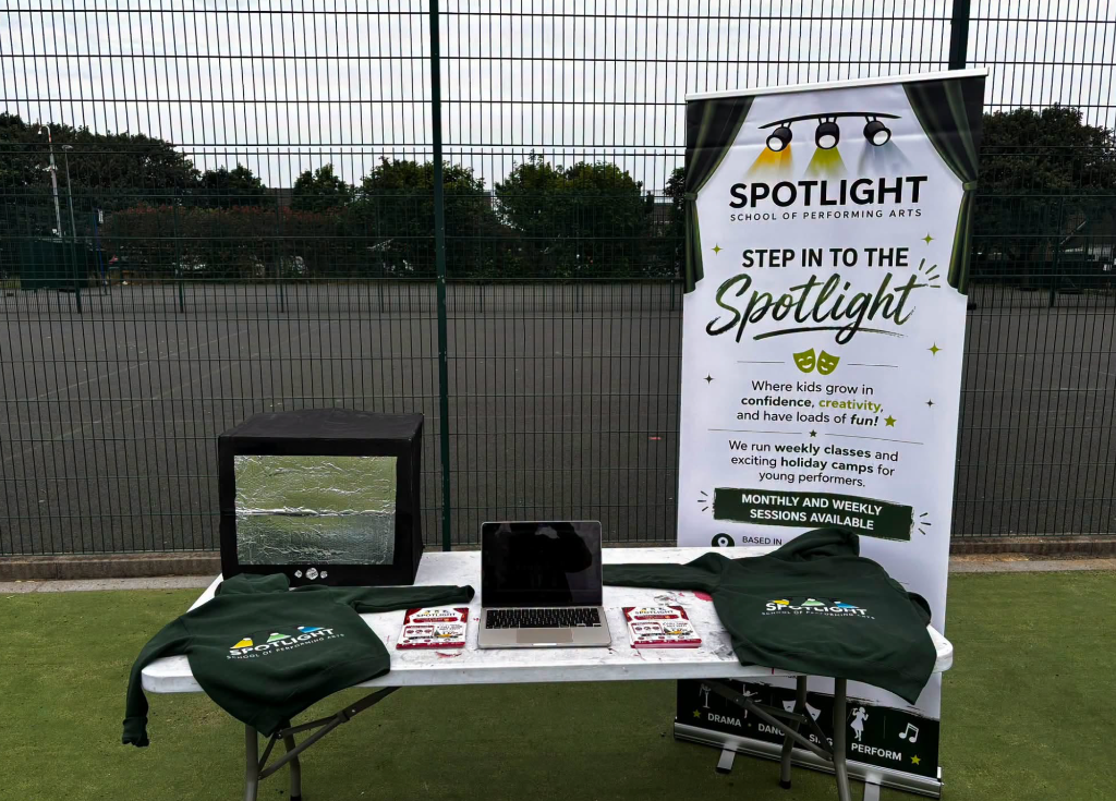 Spotlight roll-up banner at an outdoor event