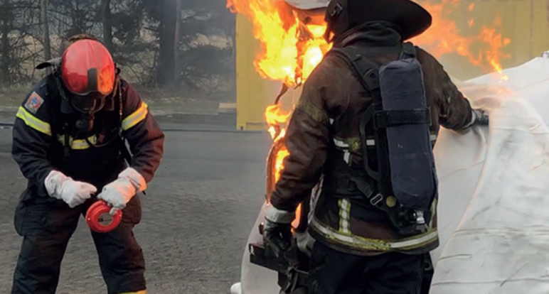 Trained firefighter deploying a Fire Isolator aerosol suppression unit during an emergency response