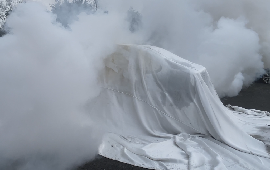 Fire Isolator Aerosol Unit Set — Blanket fully deployed over passenger EV