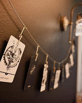 Polaroid-style photo display on a dark charcoal wall