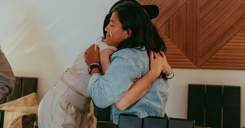 Two women embracing at the mini-retreat