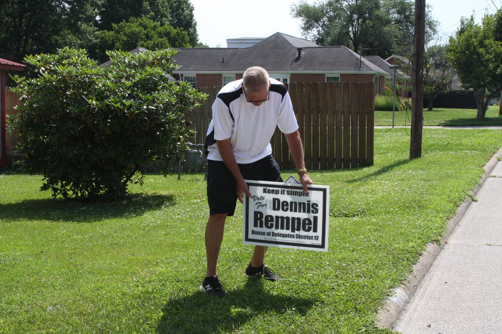 Dennis Rempel on the campaign trail: Planting a yard sign