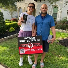 Couple next to Gen Pro Generators power protected sign in front of new construction Houston Texas home