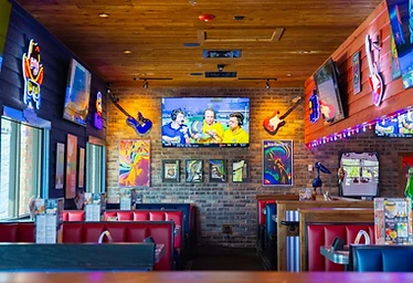 Bubba's 33 — Sports Bar with Neon & Guitar Decor