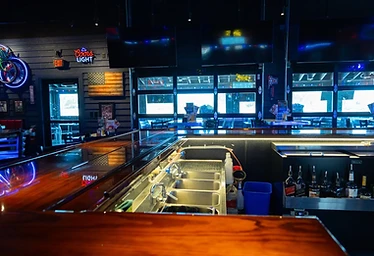 Bubba's 33 — Bar Counter with Neon Signage