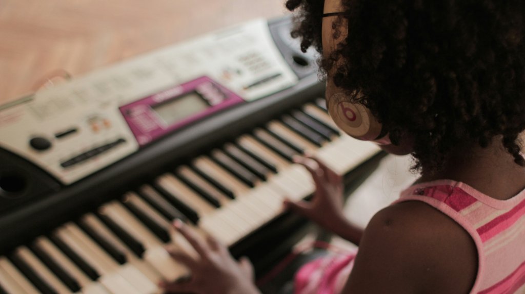 A child playing keyboard at home