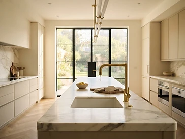 Pristine residential cleaning in Summerlin NV, luxury kitchen with polished marble countertops maintained by Serene Sparkle