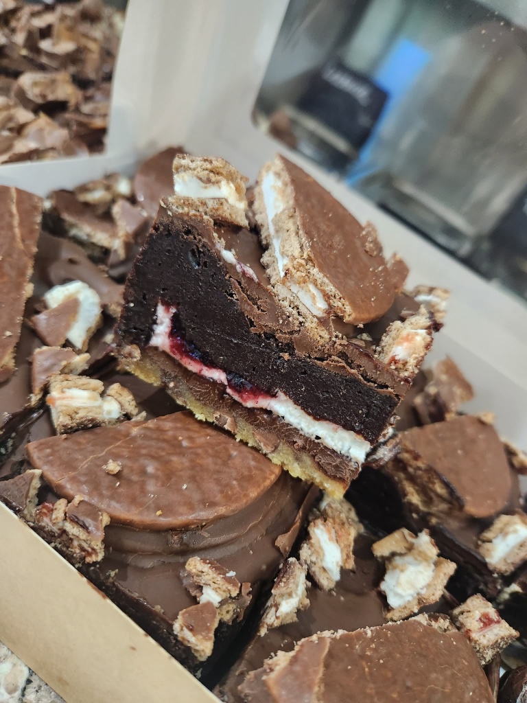 Jammy slutty brownie with jam and marshmallow layers