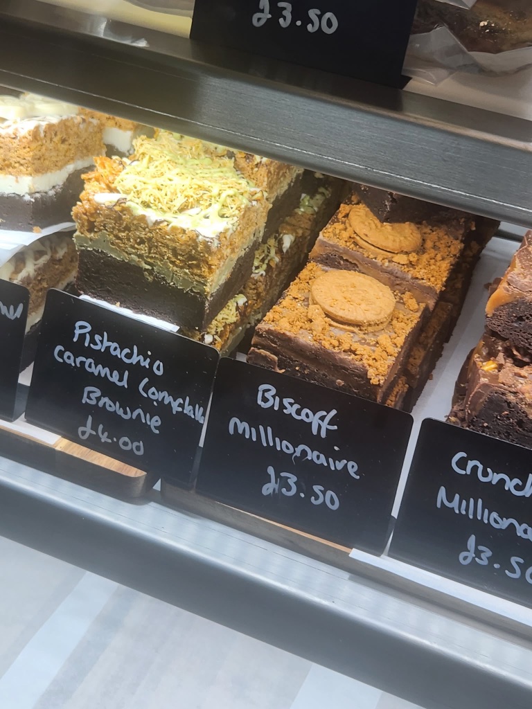 Pistachio caramel cornflake brownie topped with pistachios and cornflake crunch