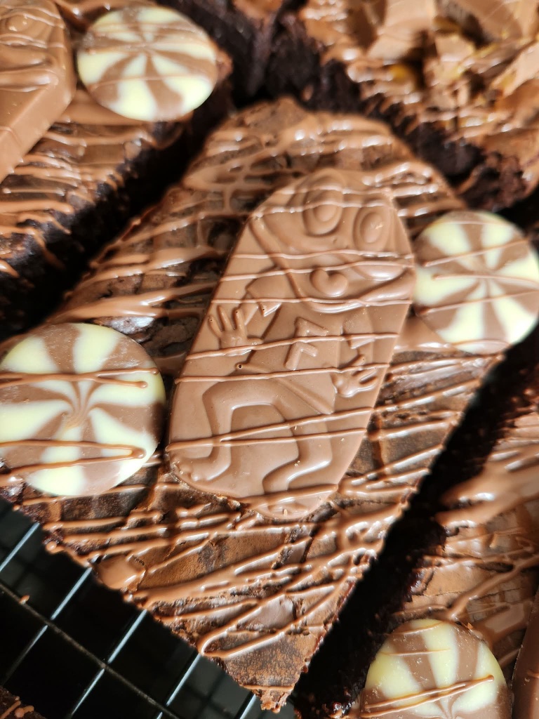 Freddo brownie topped with a Freddo frog and chocolate swirl buttons