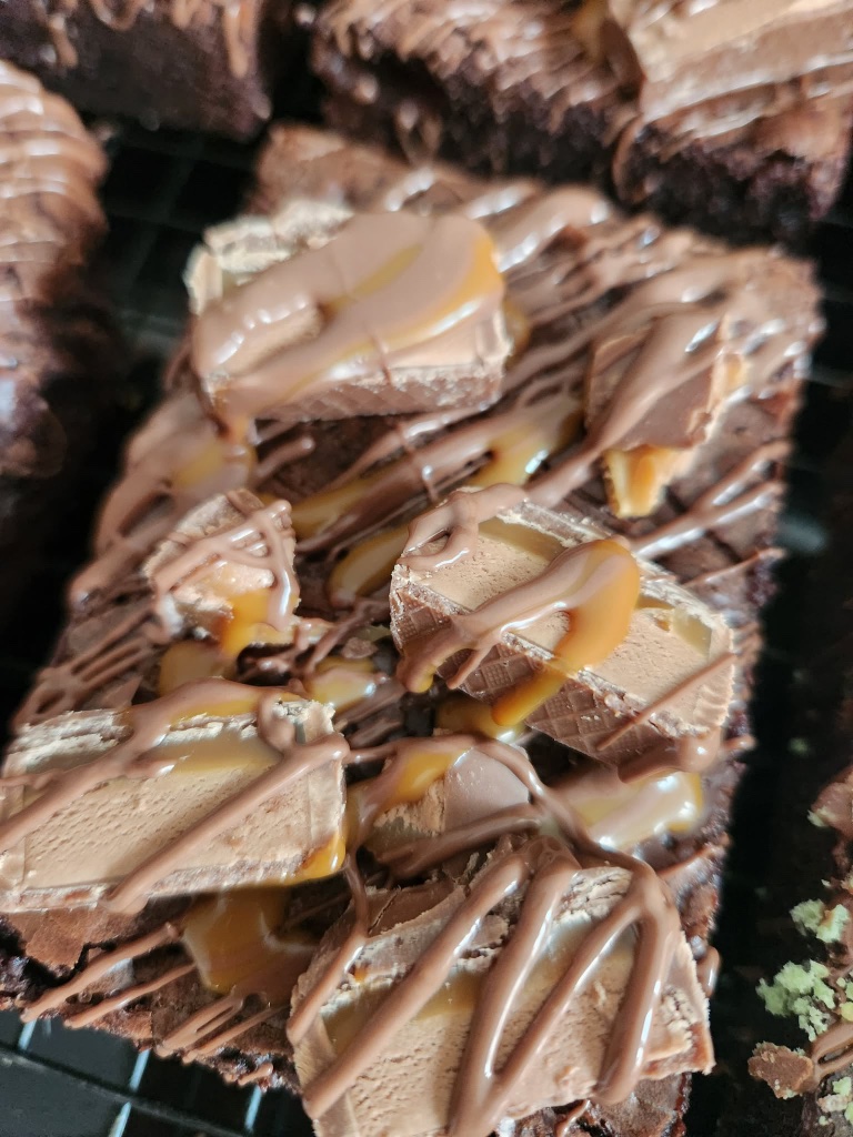 Mars brownie topped with Mars bar chunks and caramel drizzle