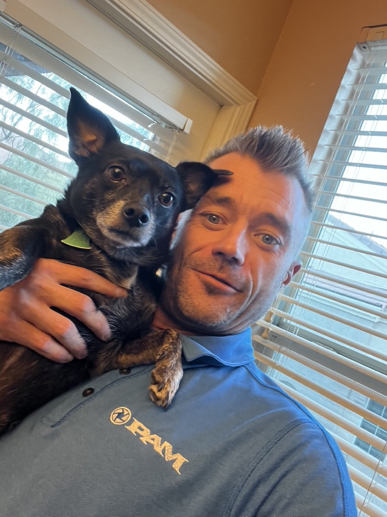 Christopher Kabat with Hawk in a candid owner-led company portrait.