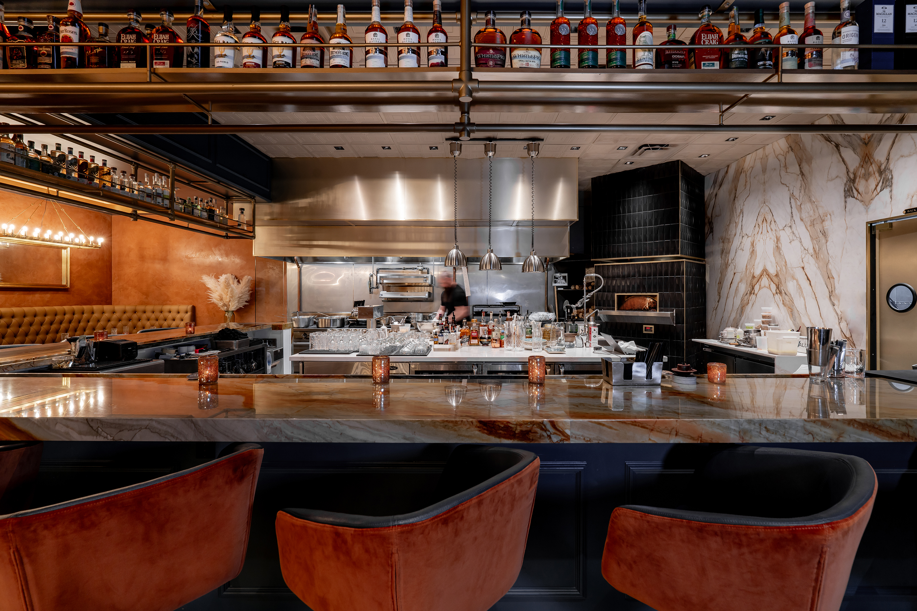 The marble bar, velvet stools and open kitchen inside Barley & Smoke, the speakeasy hidden in the brewery