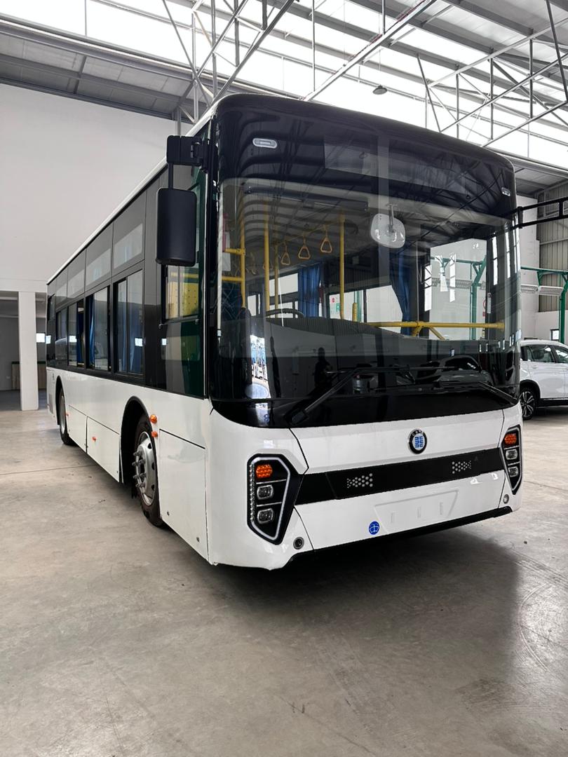 Electric city bus in maintenance facility