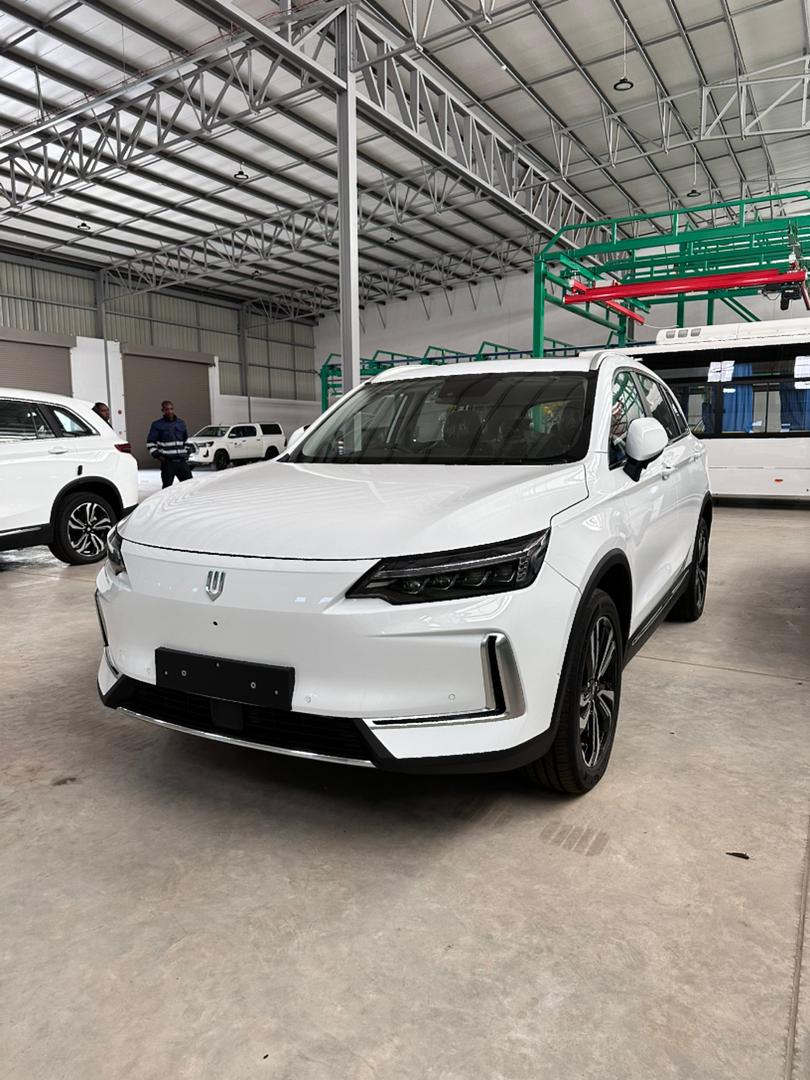 White electric SUV in warehouse
