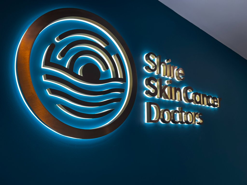 Shire Skin Cancer Doctors — photo 2: Halo-Illuminated 3D Logo, Brushed Bronze Lettering, Consult Room Wayfinding, Wall Signage
