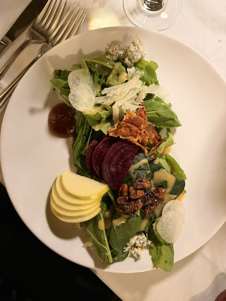 First Bite — Beet, apple and blue cheese salad with candied pecans.
