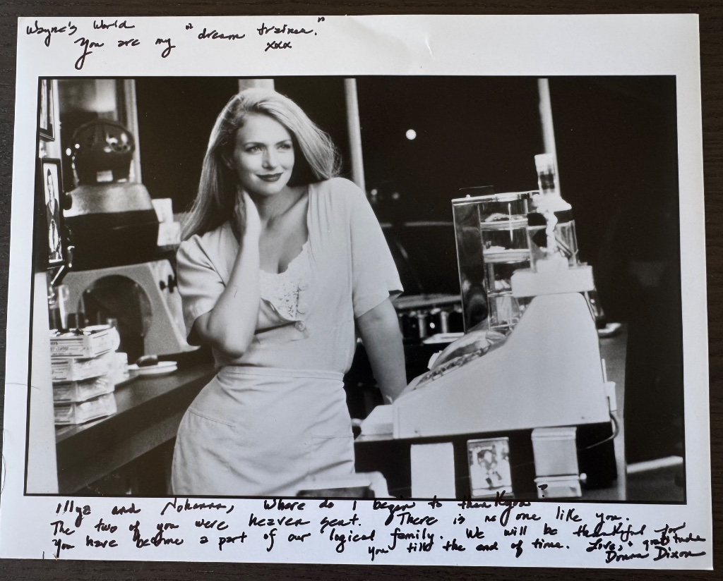 Autographed black-and-white photograph of Donna Dixon, with a handwritten note to Illya and Johanna calling them a part of her logical family.