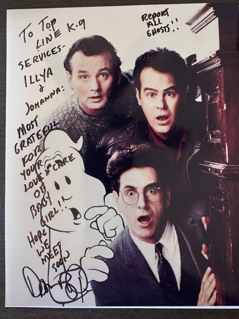 Autographed Ghostbusters photograph signed by Bill Murray, Dan Aykroyd, and Harold Ramis, with a handwritten note to Illya and Johanna thanking them for the love and care of Baby Girl.