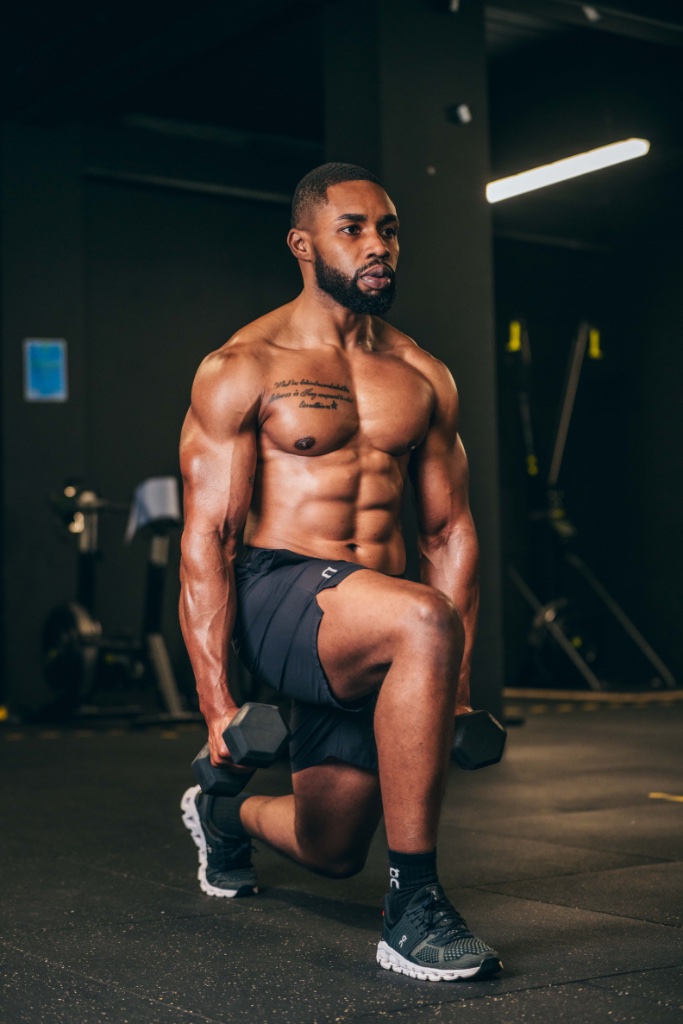 Athlete training in a dark Dublin gym at dawn