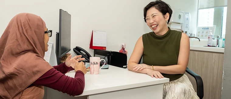 Dr Shilla sharing a light moment with a patient during a consultation