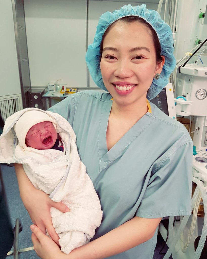 Dr Shilla Mariah Yussof holding a newborn baby