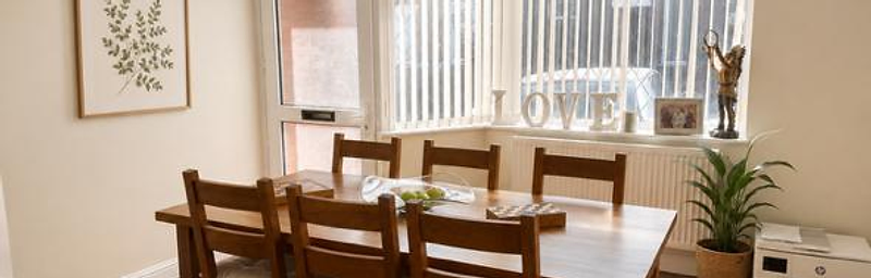 Bright dining room furnished to a premium standard