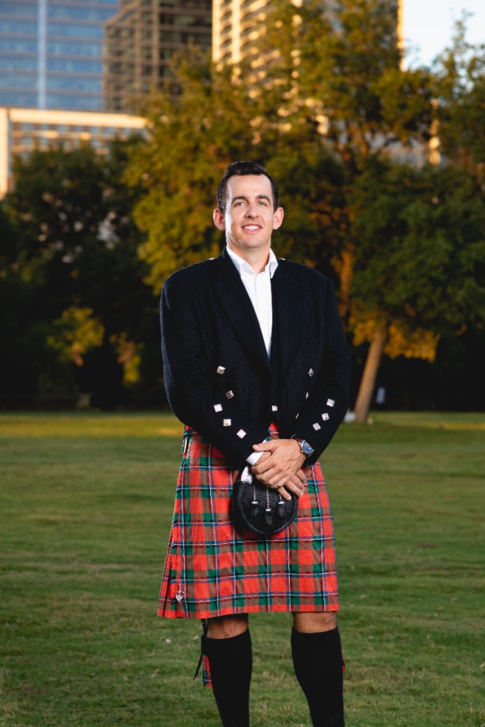 Callum Sinclair overlooking downtown Austin in his signature kilt