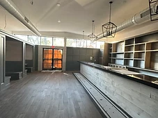 Bar area, vaulted ceiling and hardwood flooring