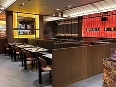 Dining room with red glass feature wall
