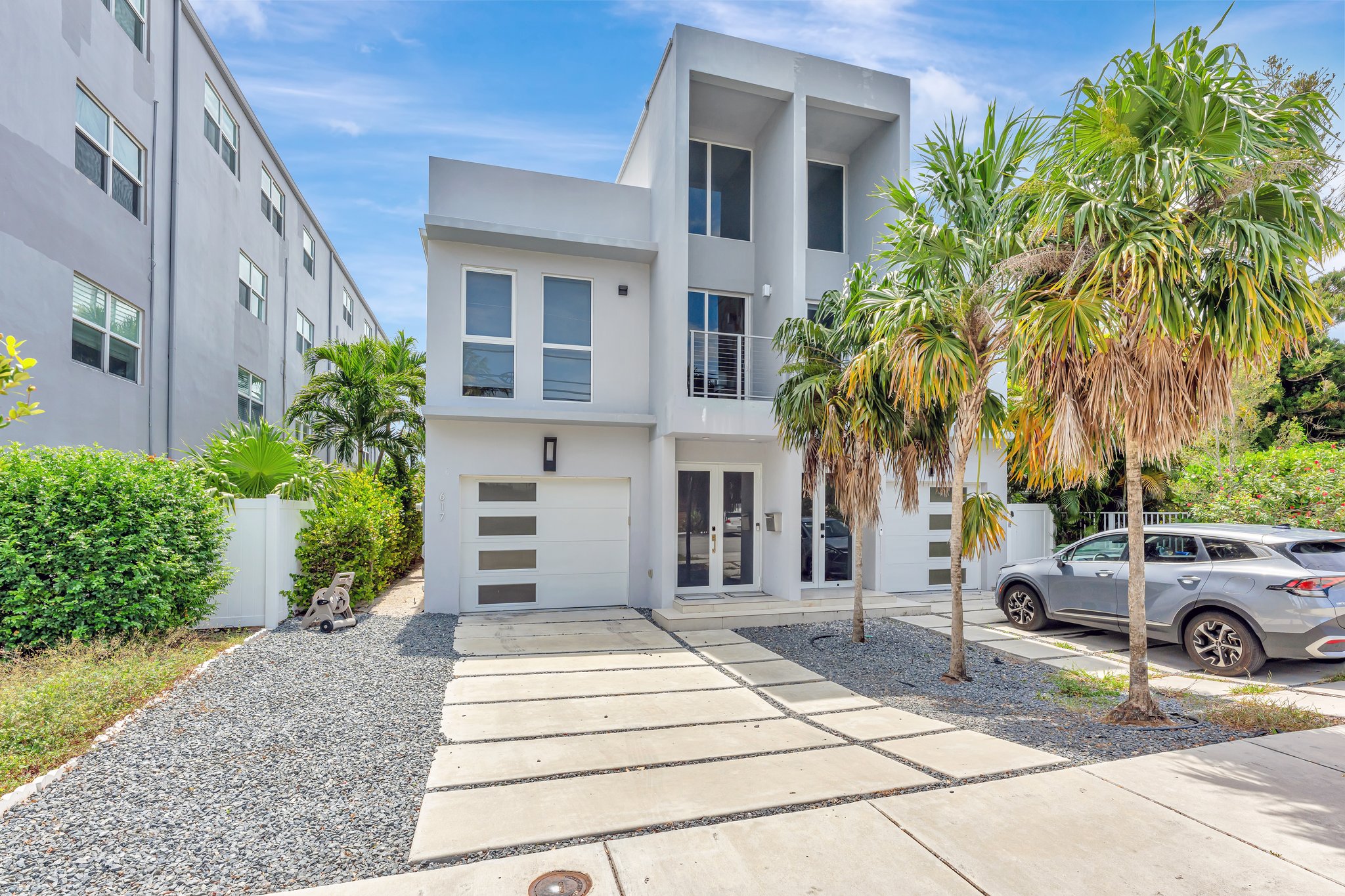 Contemporary tri-level townhouse at 617 NE 14th Ave in Victoria Park, Fort Lauderdale with rooftop terrace and open-concept living
