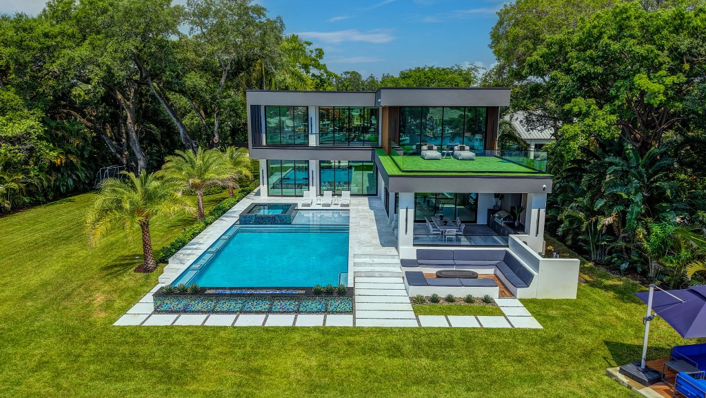 Brand-new riverfront estate on the New River in Fort Lauderdale with pool, dock, and downtown skyline views