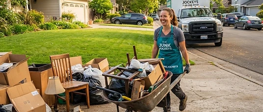 Certified junk removers hauling clutter from a driveway