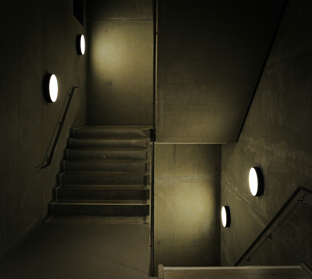 Concrete stairwell with warm wall lights