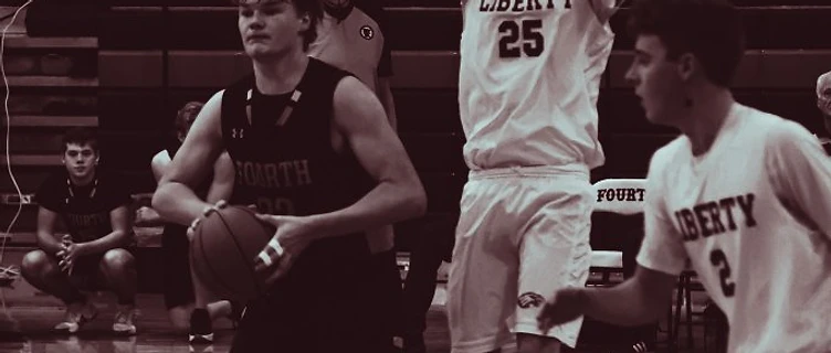 MACS varsity basketball game action
