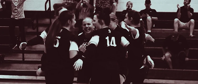 MACS volleyball team celebrating a point