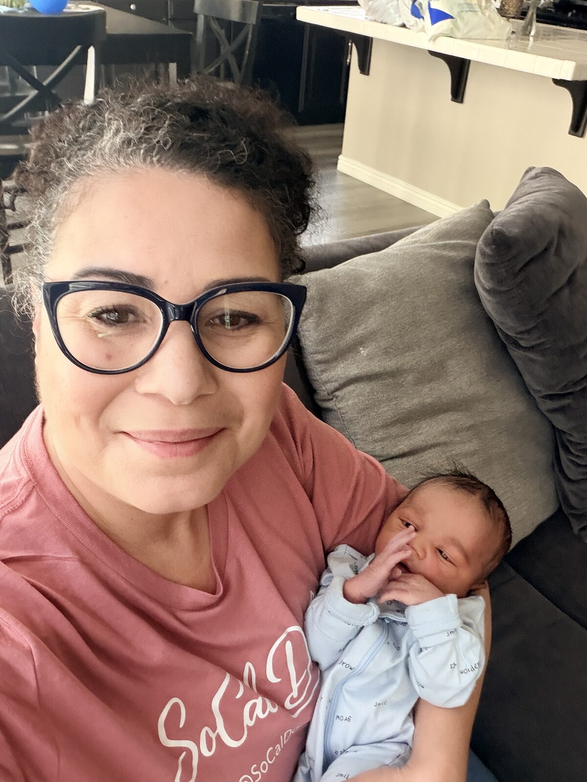 Tayna Chessman, licensed midwife, with newborn client