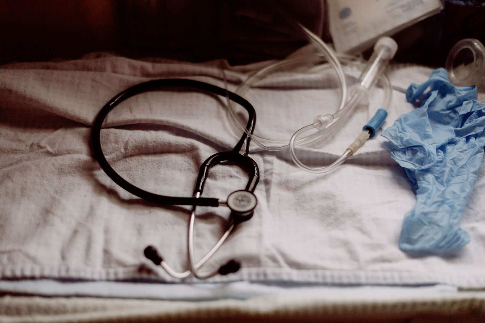 Midwifery emergency equipment including stethoscope and IV supplies