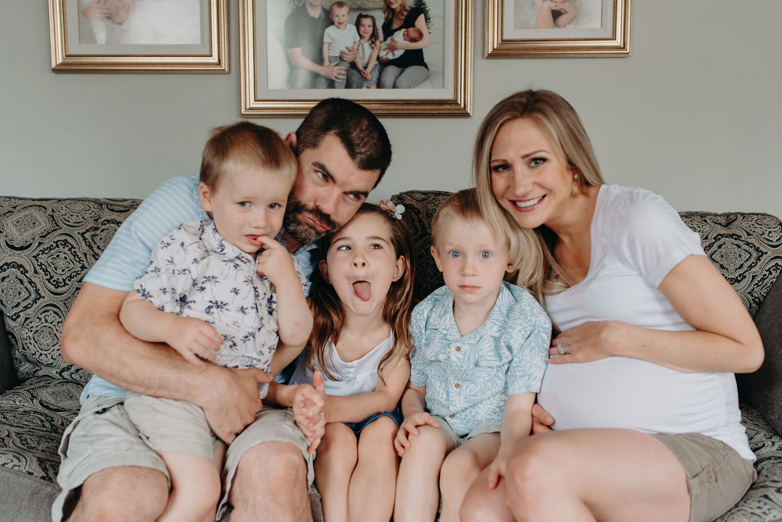 Pregnant mother with partner and three children at home