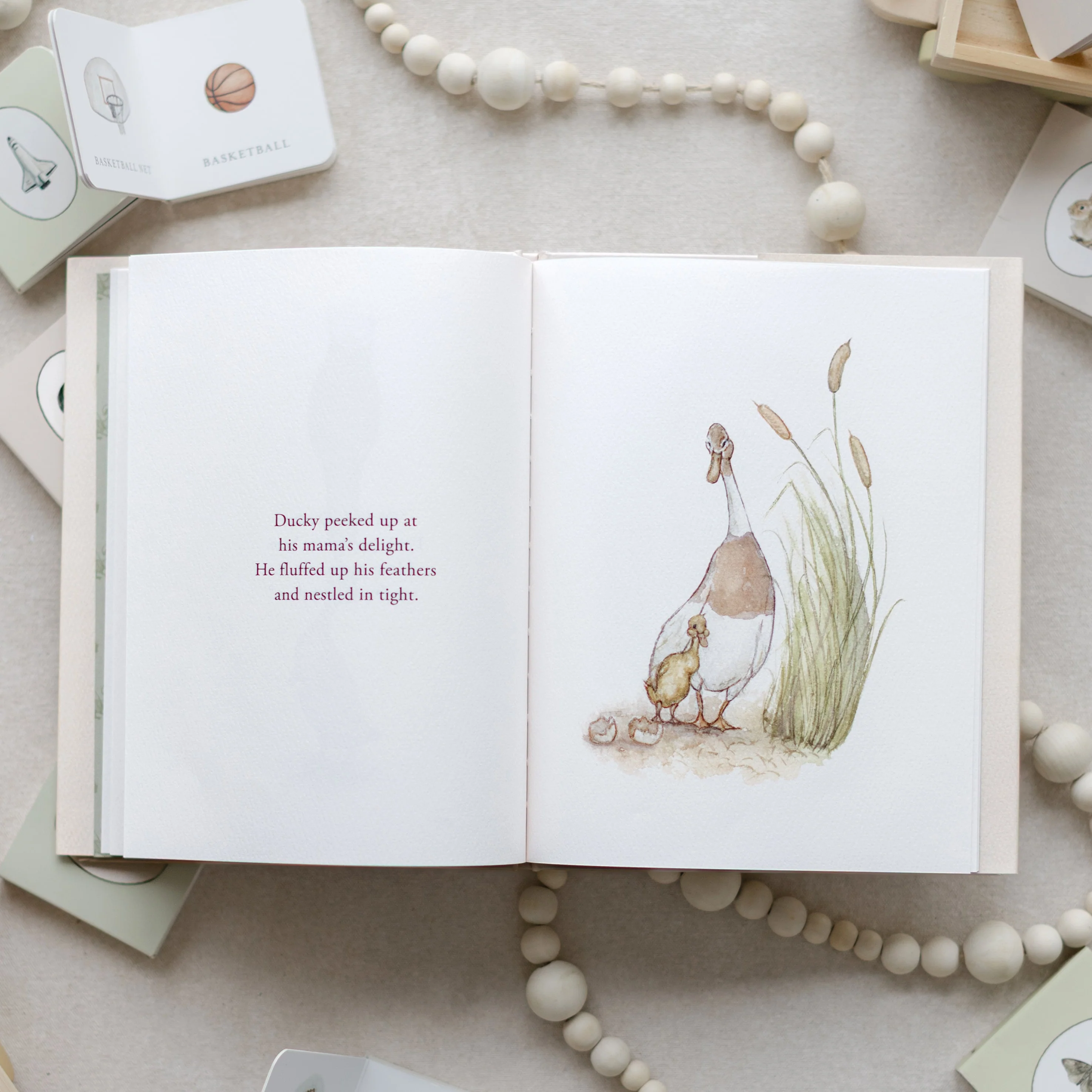 Open spread of the book showing a duck and duckling illustration
