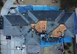 Top-down view of the re-roof in progress across the home's hip-and-gable roof geometry.