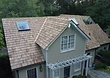 Aerial view showing dormer detailing and the unified shake system across the property.