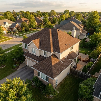 Finished roof — warm-toned designer shingles installed with starter shingle reinforcement.