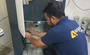 Service & Aftermarket Solutions — Aryans technician servicing a Fast & Fluid tinting machine
