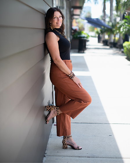 Gina Michael smiling — coach, social worker and podcast co-host