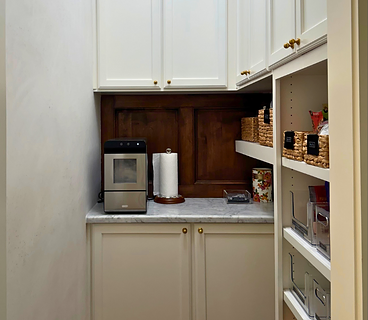 Custom butler's pantry with built-in cabinetry and shelving