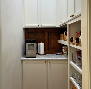 Custom butler's pantry with built-in cabinetry and shelving