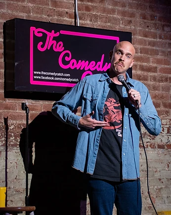 Scott Bedgood performing on stage at The Comedy Catch